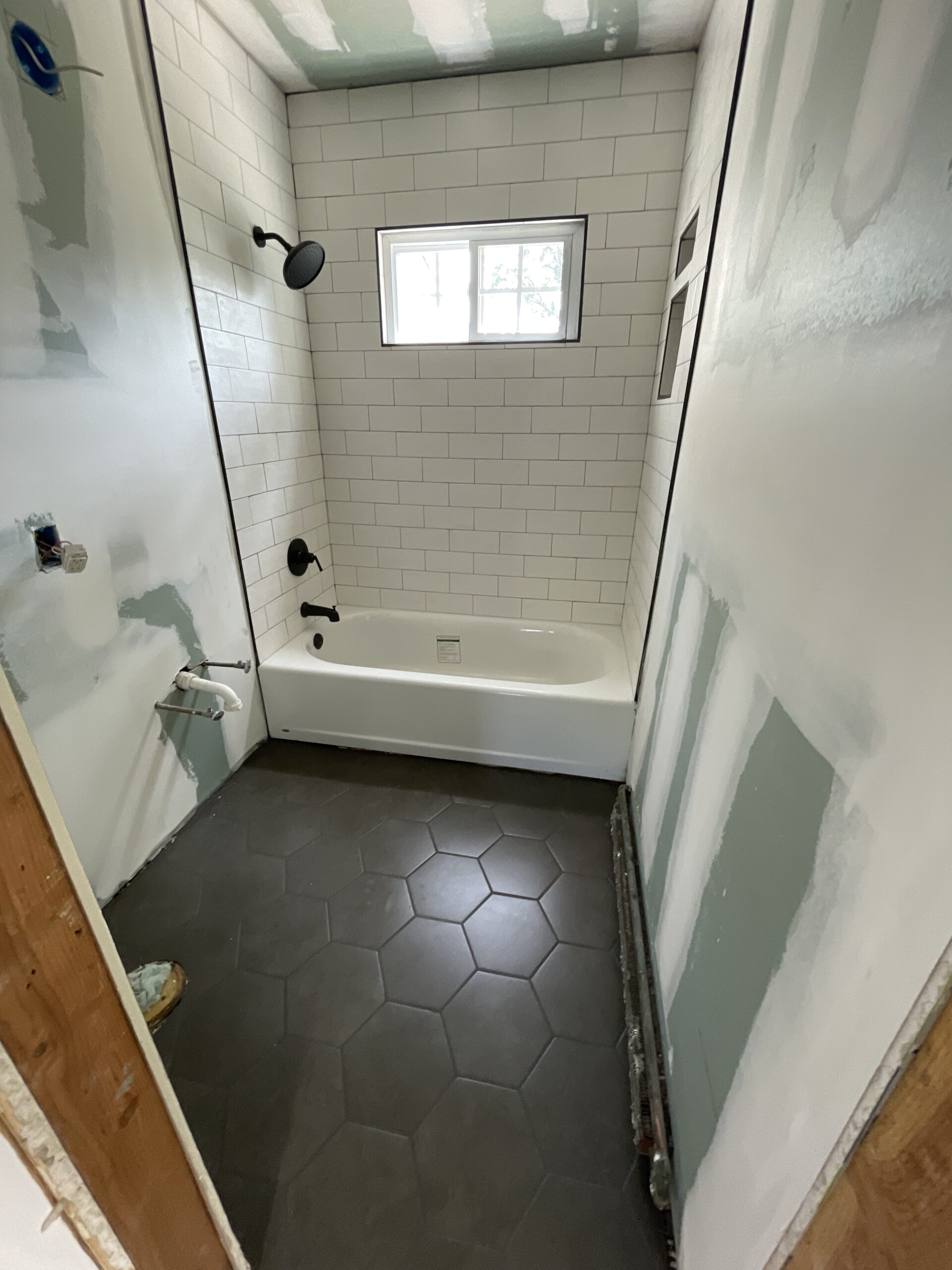 Bathroom remodel — subway tile with dark floor