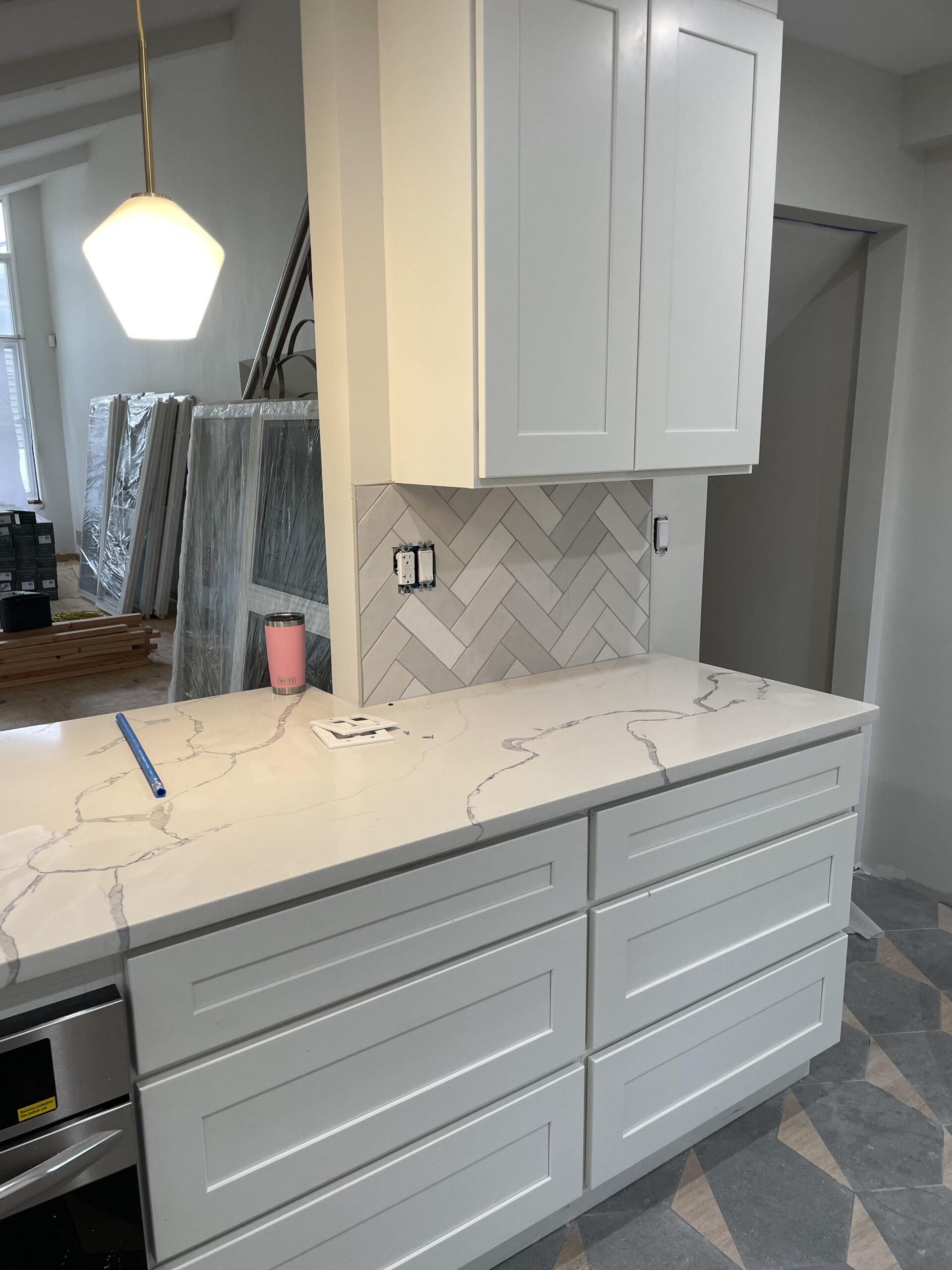 Kitchen remodel — gray cabinets with marble countertop