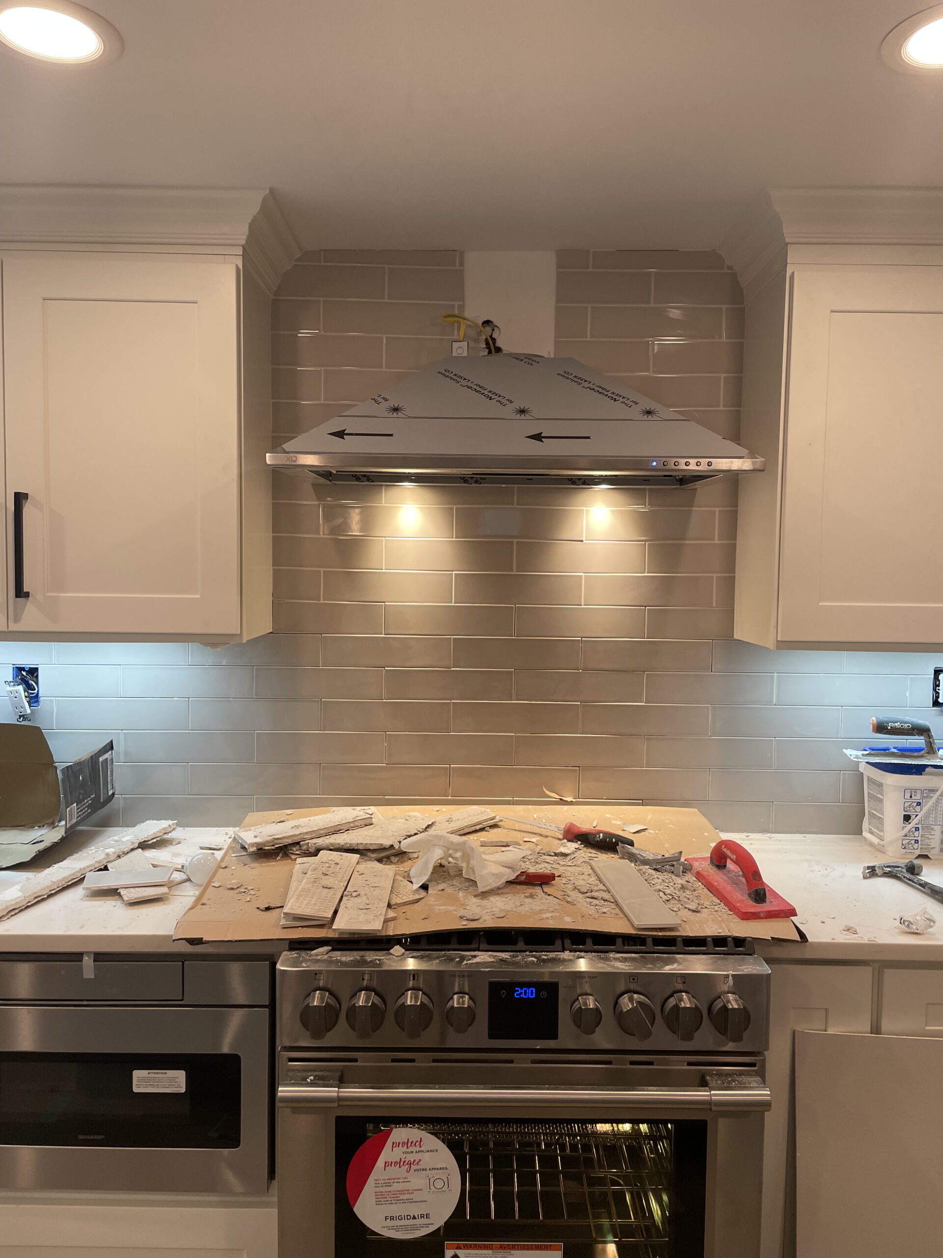 Kitchen remodel — white cabinets with range hood