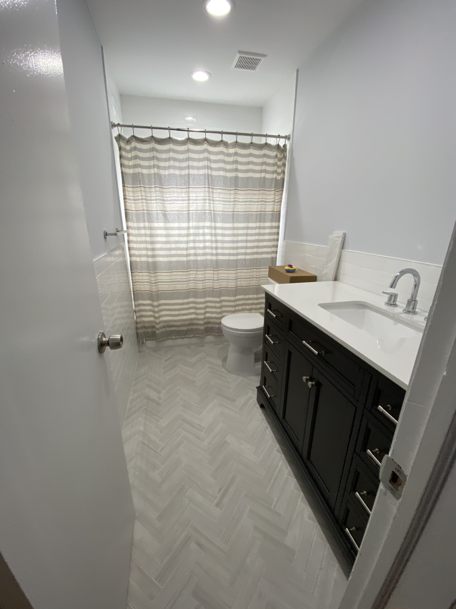 Bathroom remodel — herringbone floor