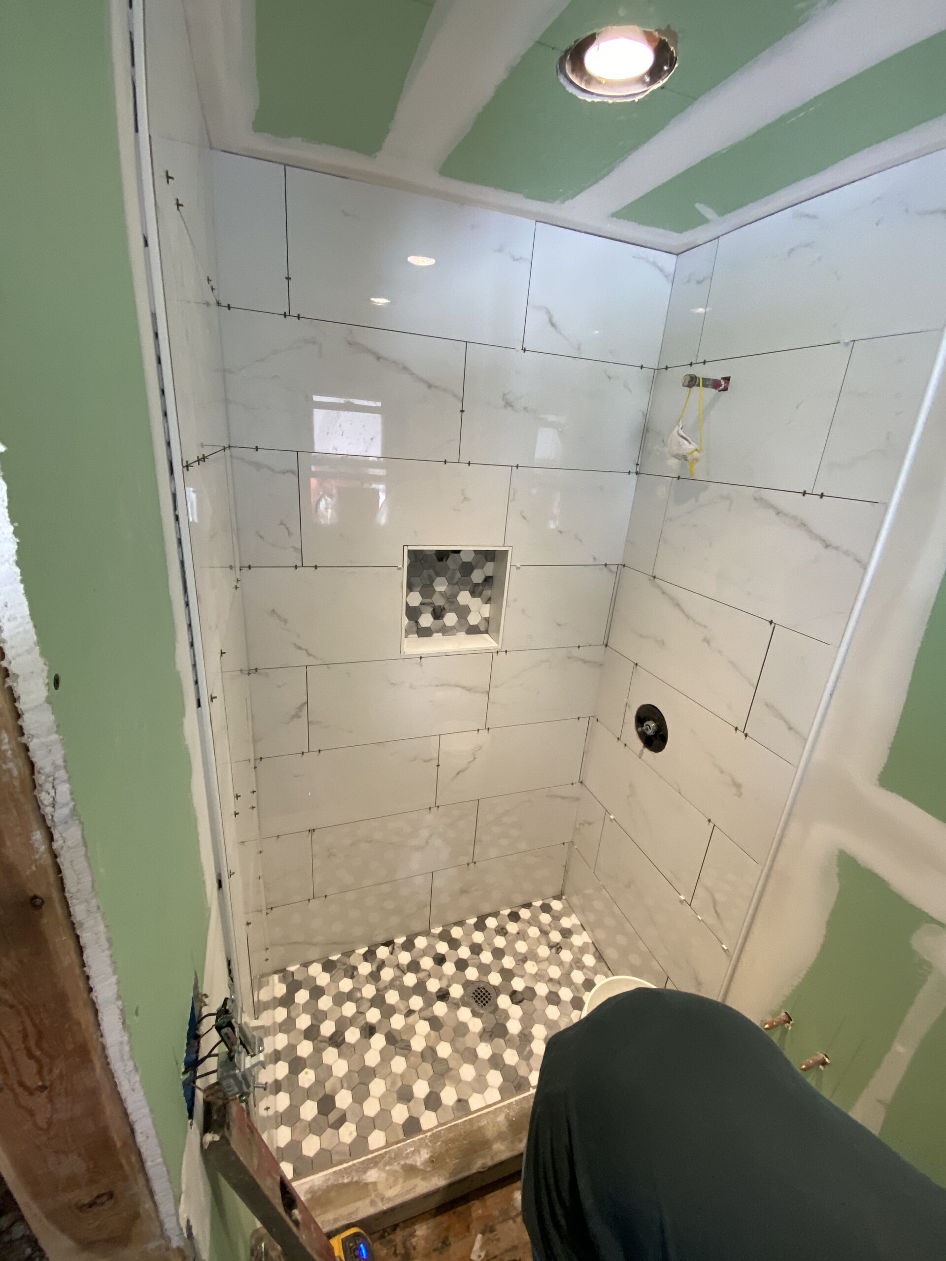 Shower remodel — white subway tile